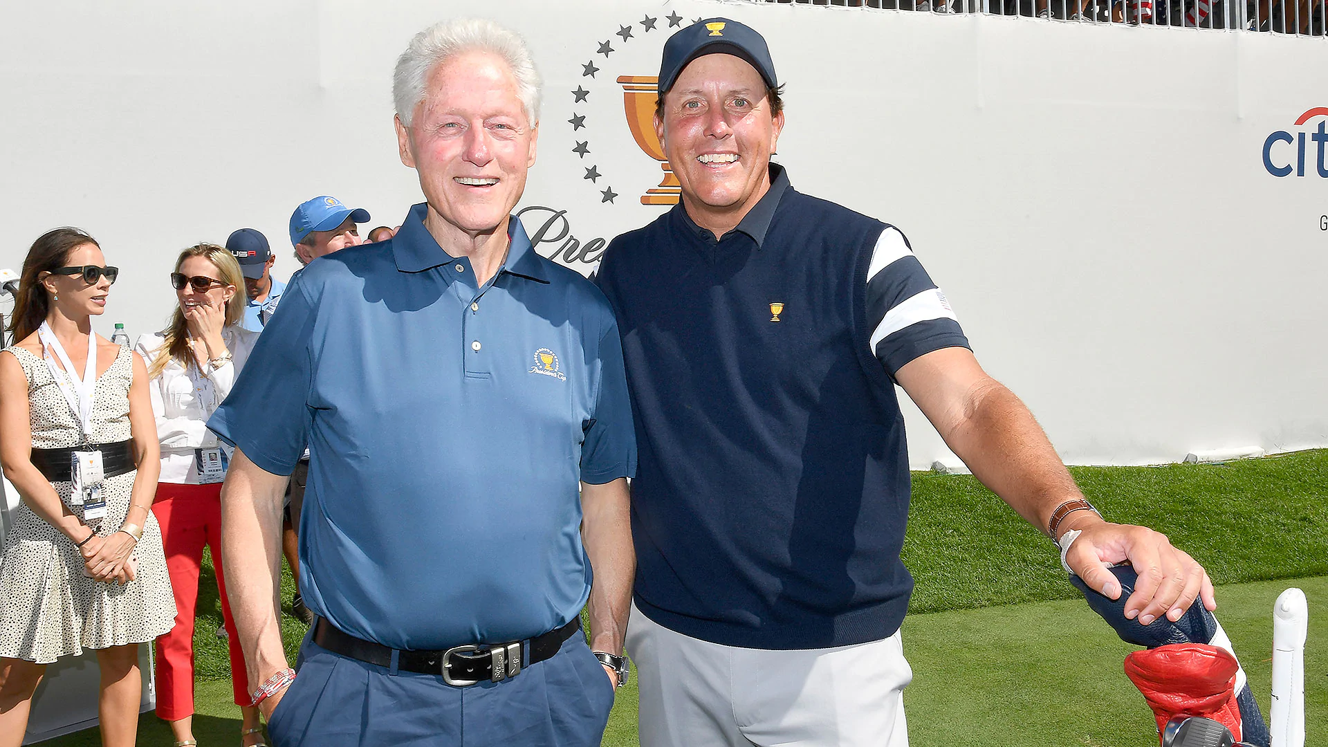 Clinton talks strategy with U.S. team on first tee