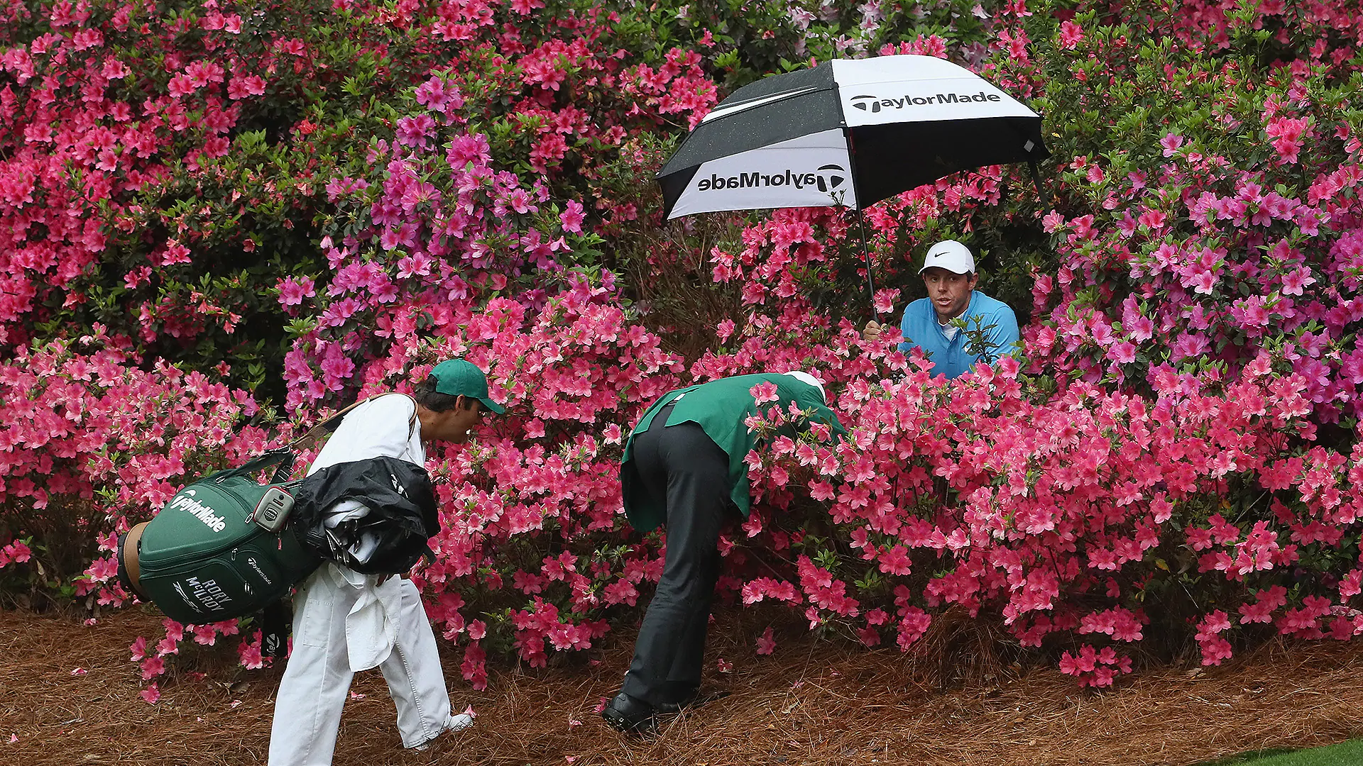McIlroy survives 'sea of pink' to salvage par at 13