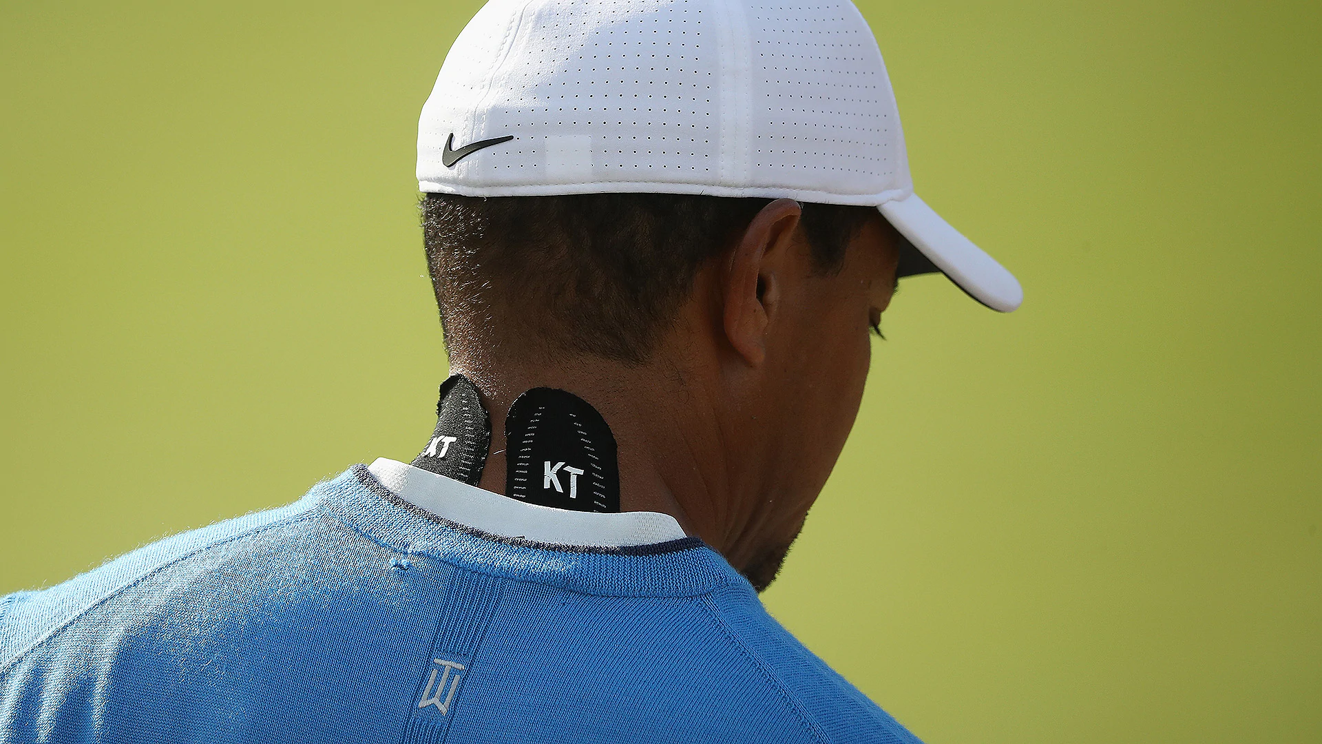 Tiger sports KT Tape to help with sore neck