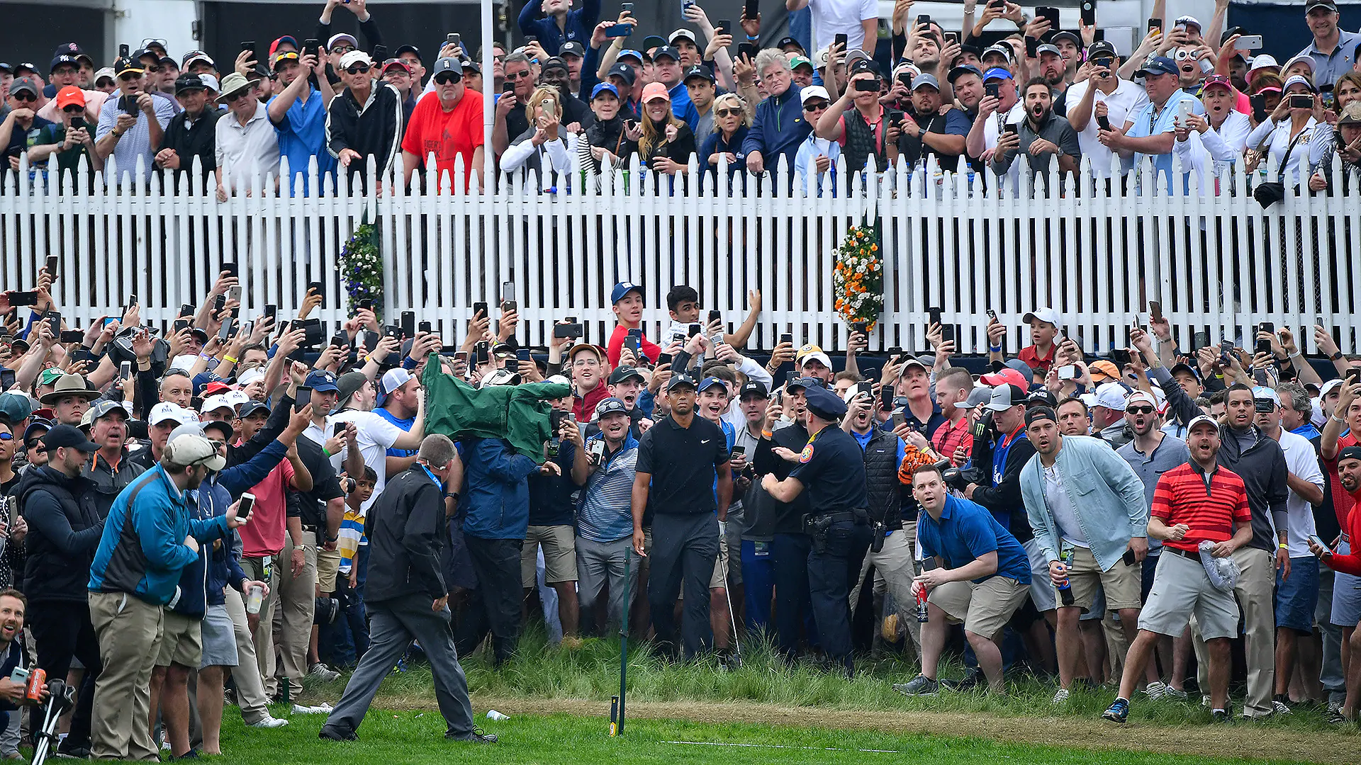 Watch: Chaos encircles Tiger after errant shot on first hole