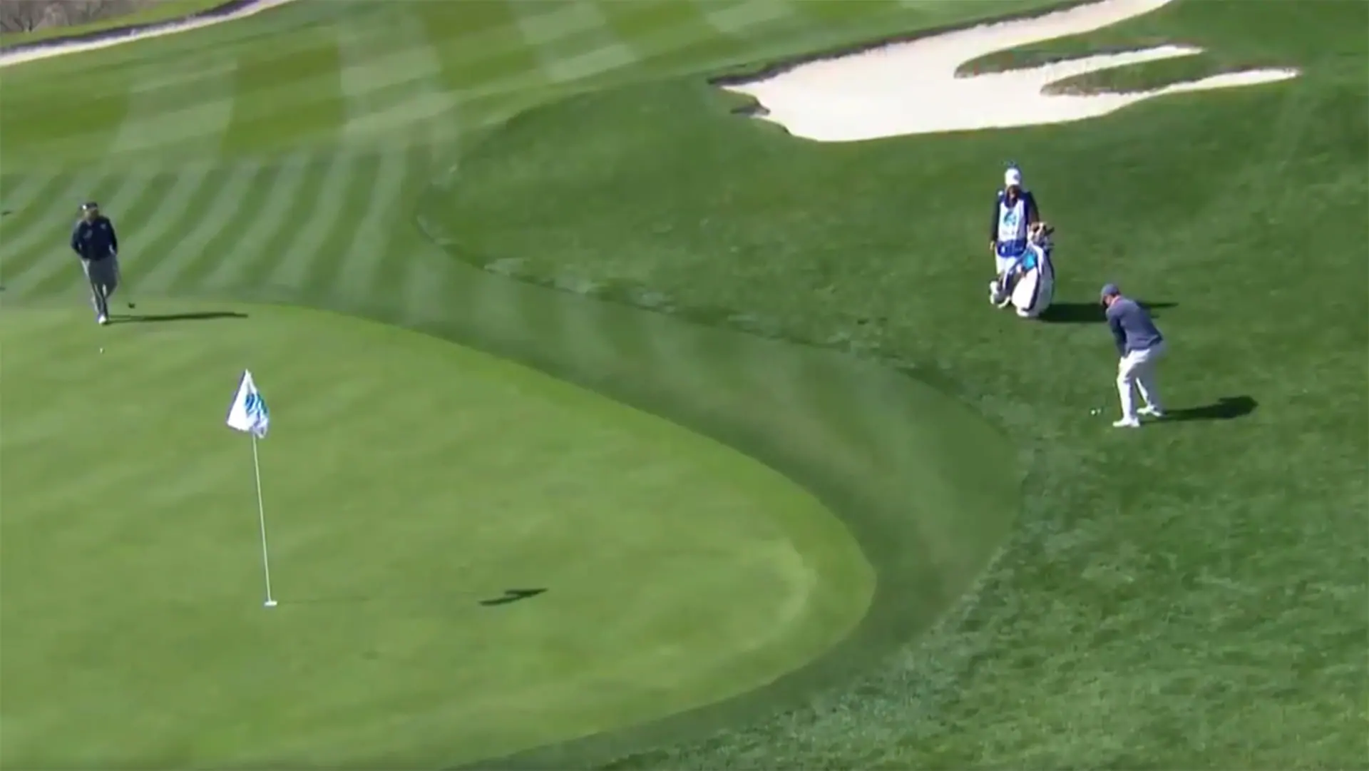 Watch: McIlroy duffs pitch, then chips in for par