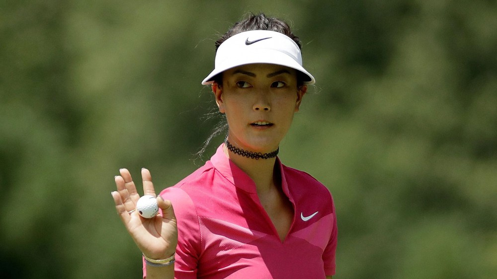Wie (70) cools after hot start, sits five back