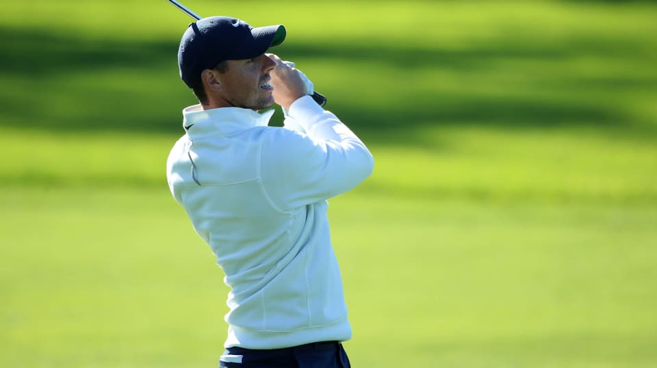 Rory McIlroy takes proper relief on No. 18 at Farmers